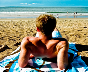 Sunburnt shoulder on the beach